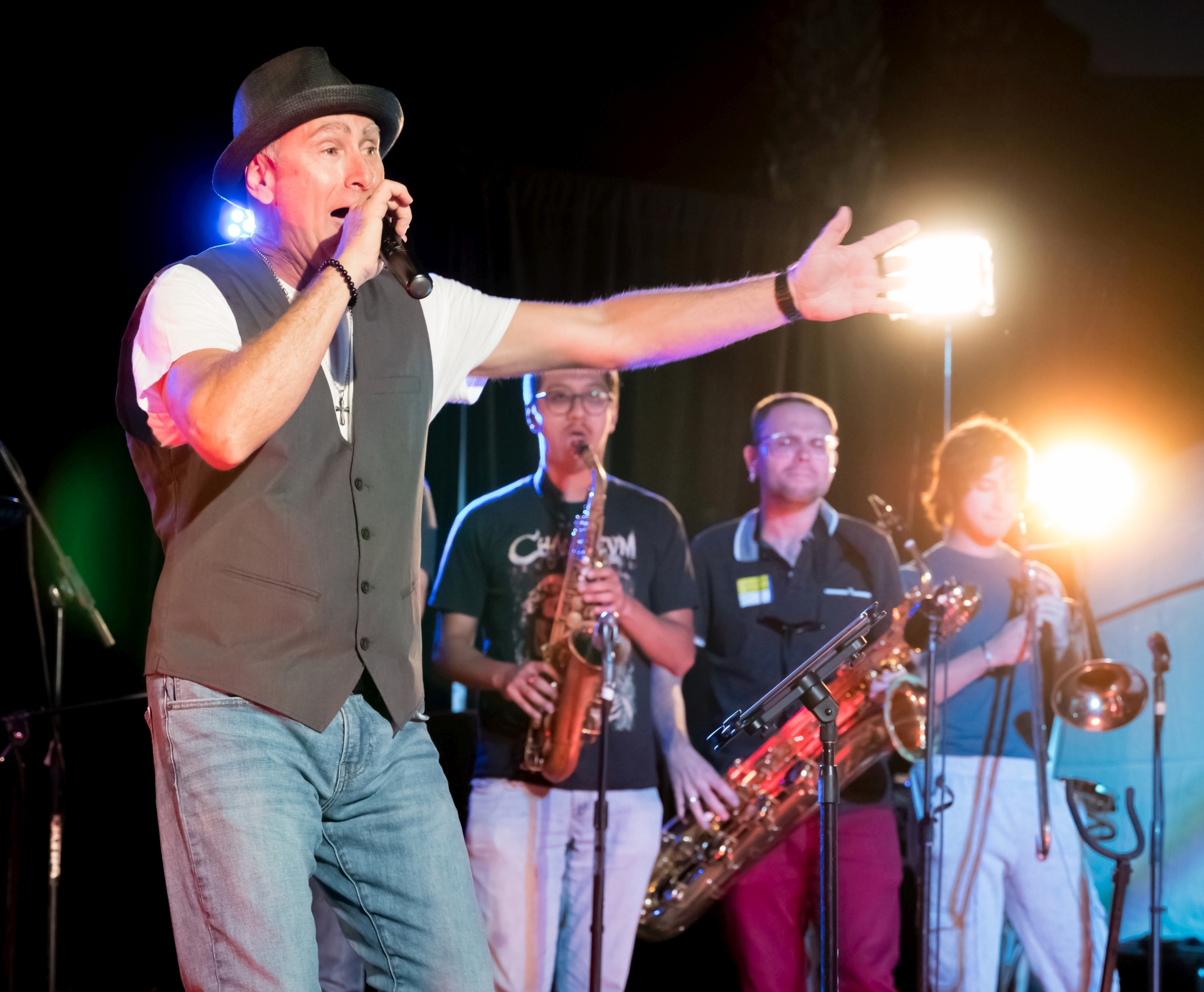 Image of the horns section playing with Sonic Shakers and Joe DeIre singing